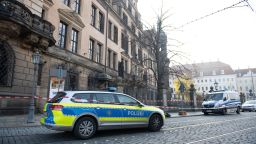 A police car stands in front of the cordoned off Royal Palace that houses the historic Green Vault (Gruenes Goelbe) in Dresden, eastern Germany on November 25, 2019, after it was broken into. - A state museum in Dresden containing billions of euros worth of baroque treasures has been robbed, police in Germany confirmed on November 25, 2019. The Green Vault at Dresden's Royal Palace, which is home to around 4000 precious objects made of ivory, gold, silver and jewels, was reportedly broken into at 5am on early morning. (Photo by Sebastian Kahnert / dpa / AFP) / Germany OUT (Photo by SEBASTIAN KAHNERT/dpa/AFP via Getty Images)