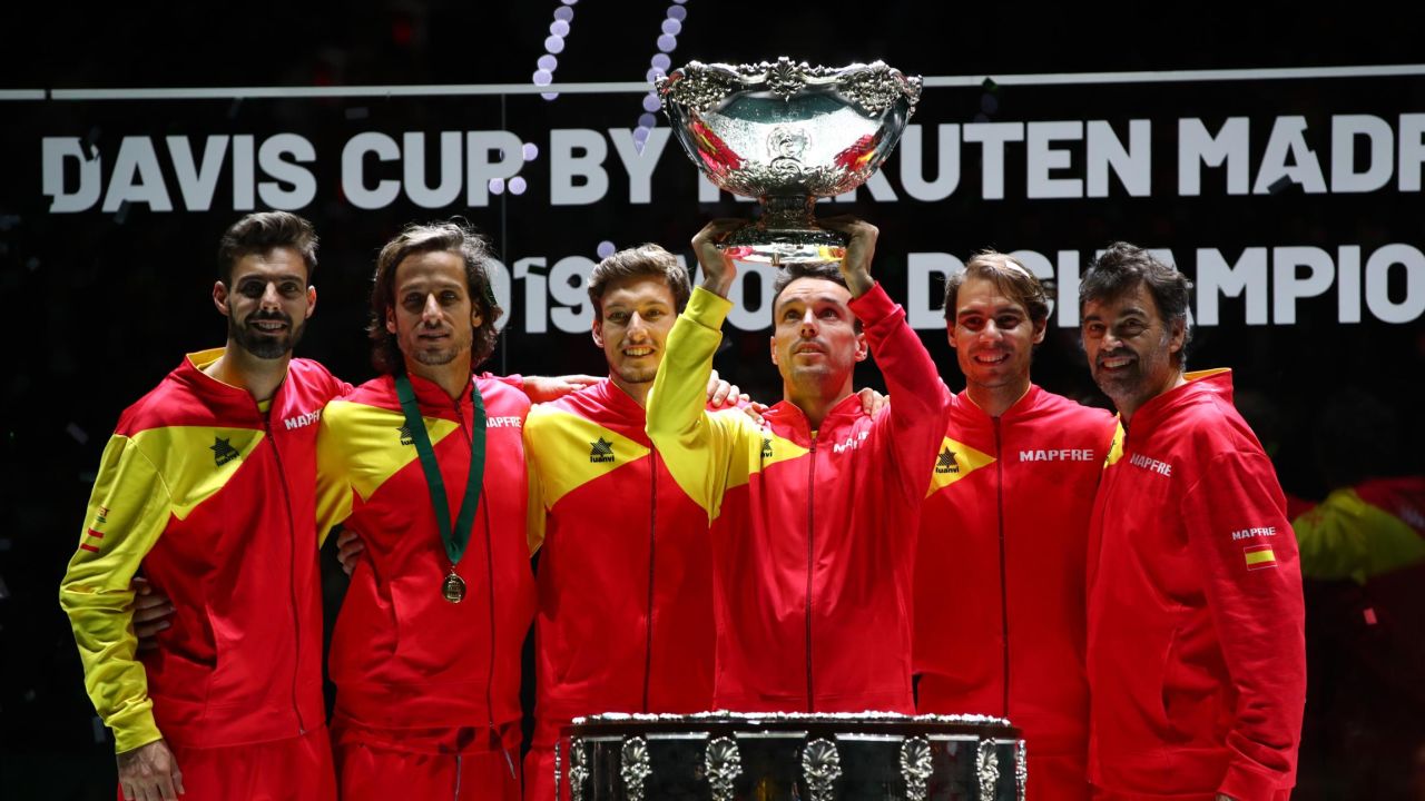 Roberto Bautista Agut lifts the trophy as Spain celebrate beating Canada in this year's Davis Cup. It is the sixth time they have won the title.
