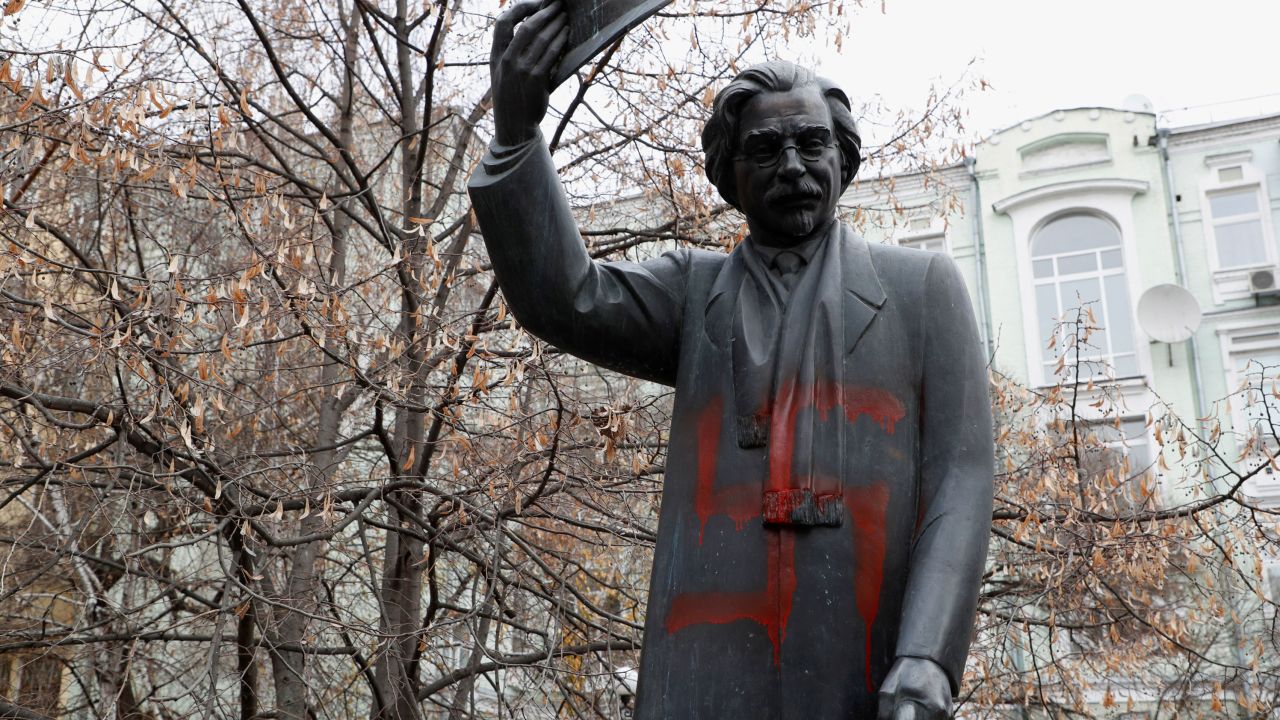 A monument to Yiddish author Sholem Aleichem is seen vandalized with swastikas in Kiev, Ukraine.