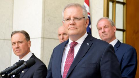 Prime Minister Scott Morrison (C) speak to media during a press conference at Parliament House on November 25 in Canberra, Australia.