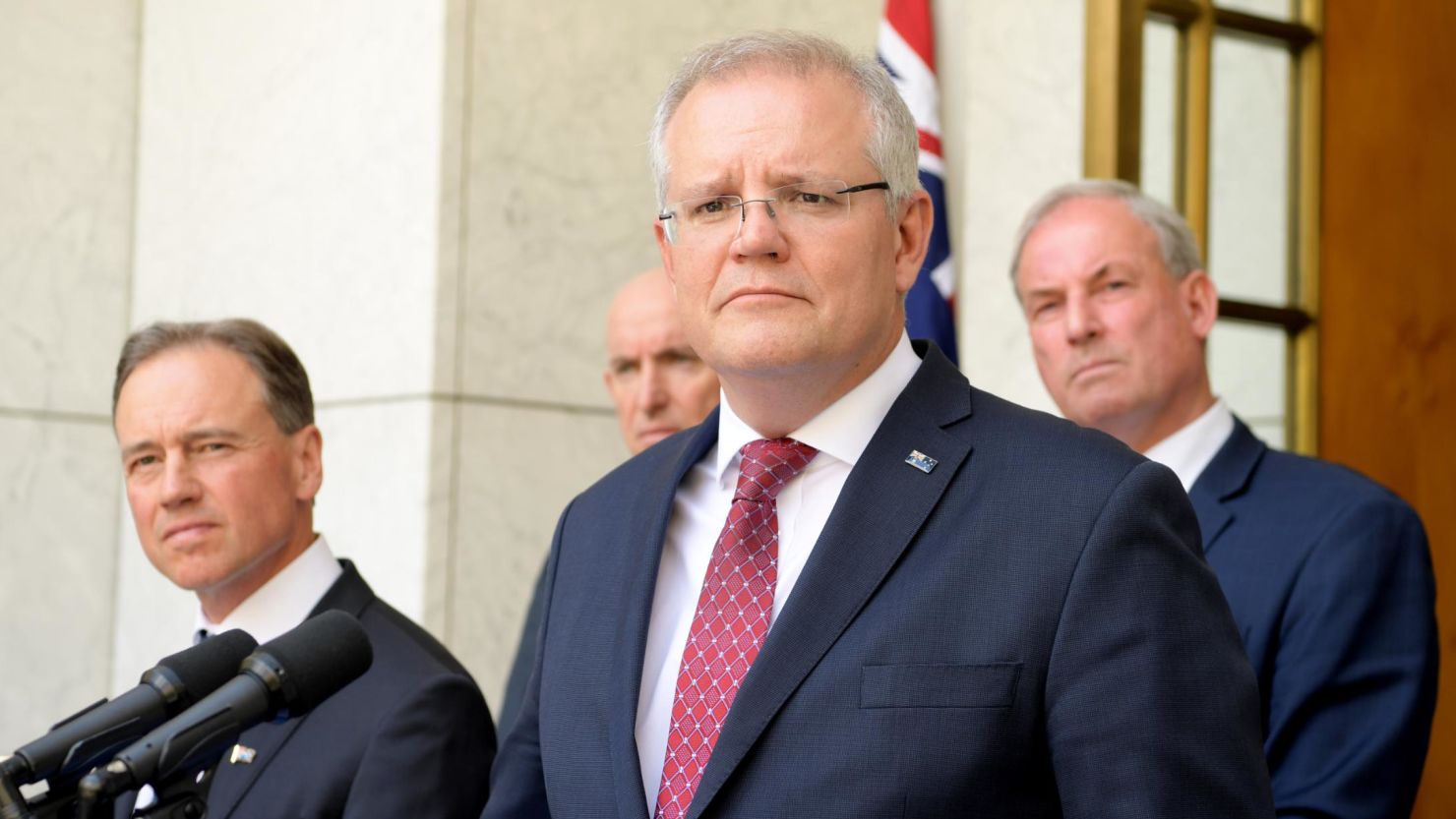 Prime Minister Scott Morrison (C) speak to media during a press conference at Parliament House on November 25 in Canberra, Australia.