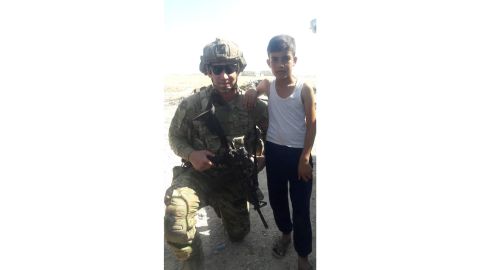 Ibrahim Hassan was glad to photograph his son with a US serviceman. But he said he felt betrayed when the Americans changed their mission.