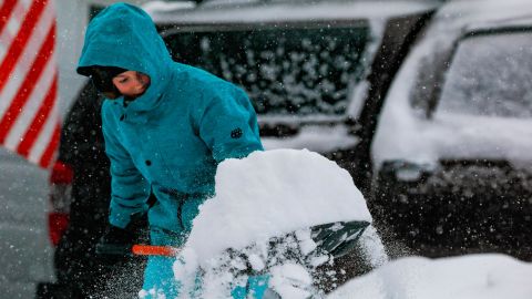 Jordan Dickman, 17, shovels some of the 11 inches of snow that fell on Denver on November 26.