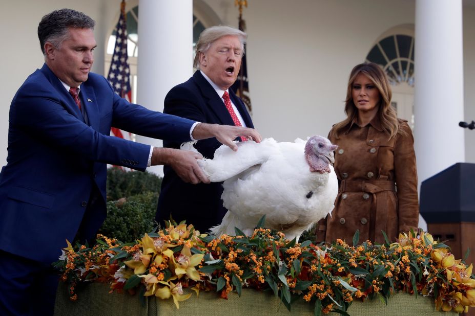 President Donald Trump is joined by his wife, Melania, as he pardons Butter the turkey on Tuesday, November 26.