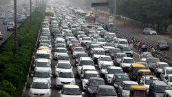 Traffic stretches back in Hero Honda chowk as waterlogging during monsoon downpours causes traffic jams in Gurgaon on July 29, 2016. 
Thousands of Indians were left stranded overnight July 29, as major traffic gridlock paralysed roads leading to a key business city near New Delhi and authorities struggled to get the situation under control. / AFP / STRINGER        (Photo credit should read STRINGER/AFP via Getty Images)