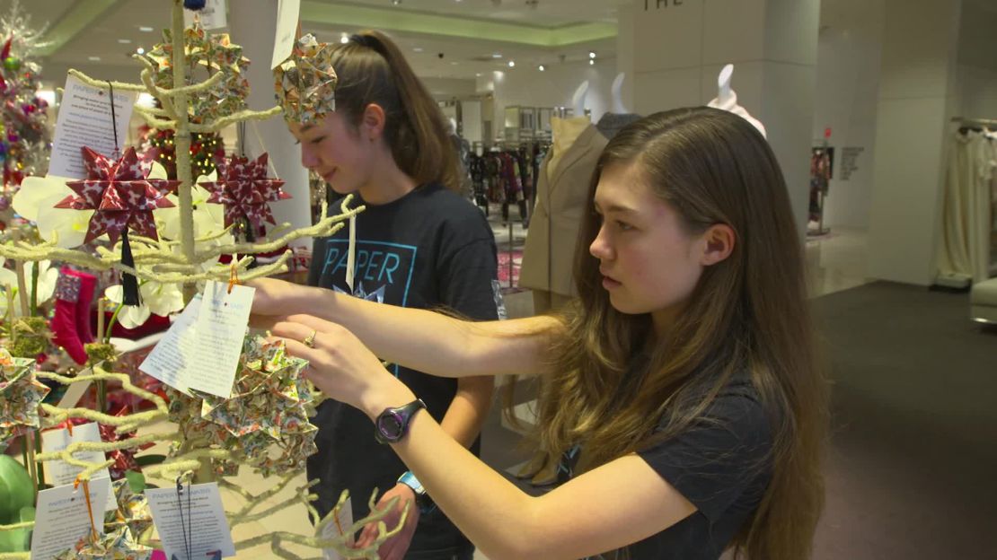 Isabelle and Katherine Adams check out the display of their ornaments at a Neiman Marcus store near their Dallas home.