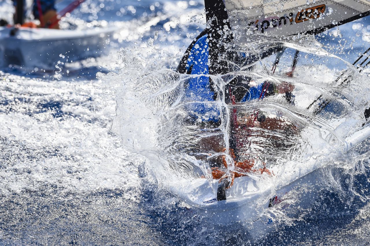 <strong>4. Martina Orsini.</strong> Spray creates the shape and sense of a shield protecting a young sailor on a O'pen Bic boat. 