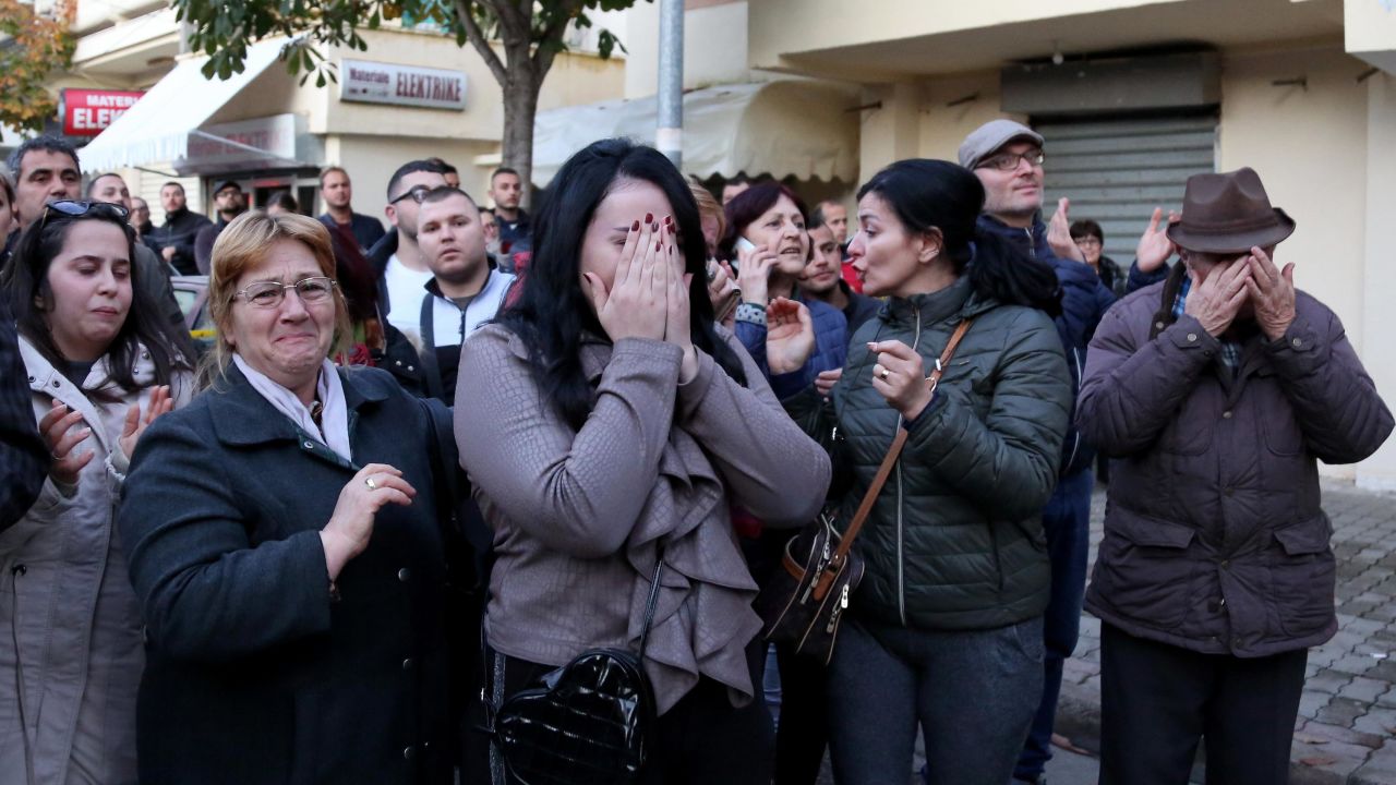 An emotional crowd gathers near a collapsed building in Durres on Tuesday.