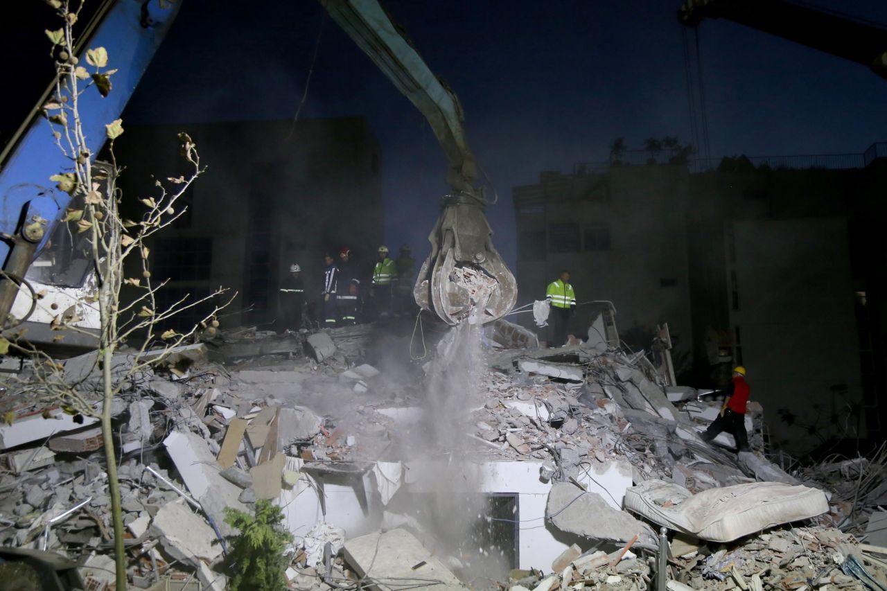 Crews search for survivors in the rubble of a building in Durres on November 26.