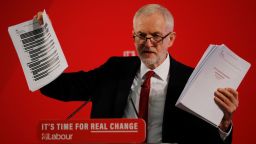 Opposition Labour party leader Jeremy Corbyn holds up redacted documents from the government's UK-US trade talks during a press conference in London on November 27, 2019. (Photo by Tolga AKMEN / AFP) (Photo by TOLGA AKMEN/AFP via Getty Images)