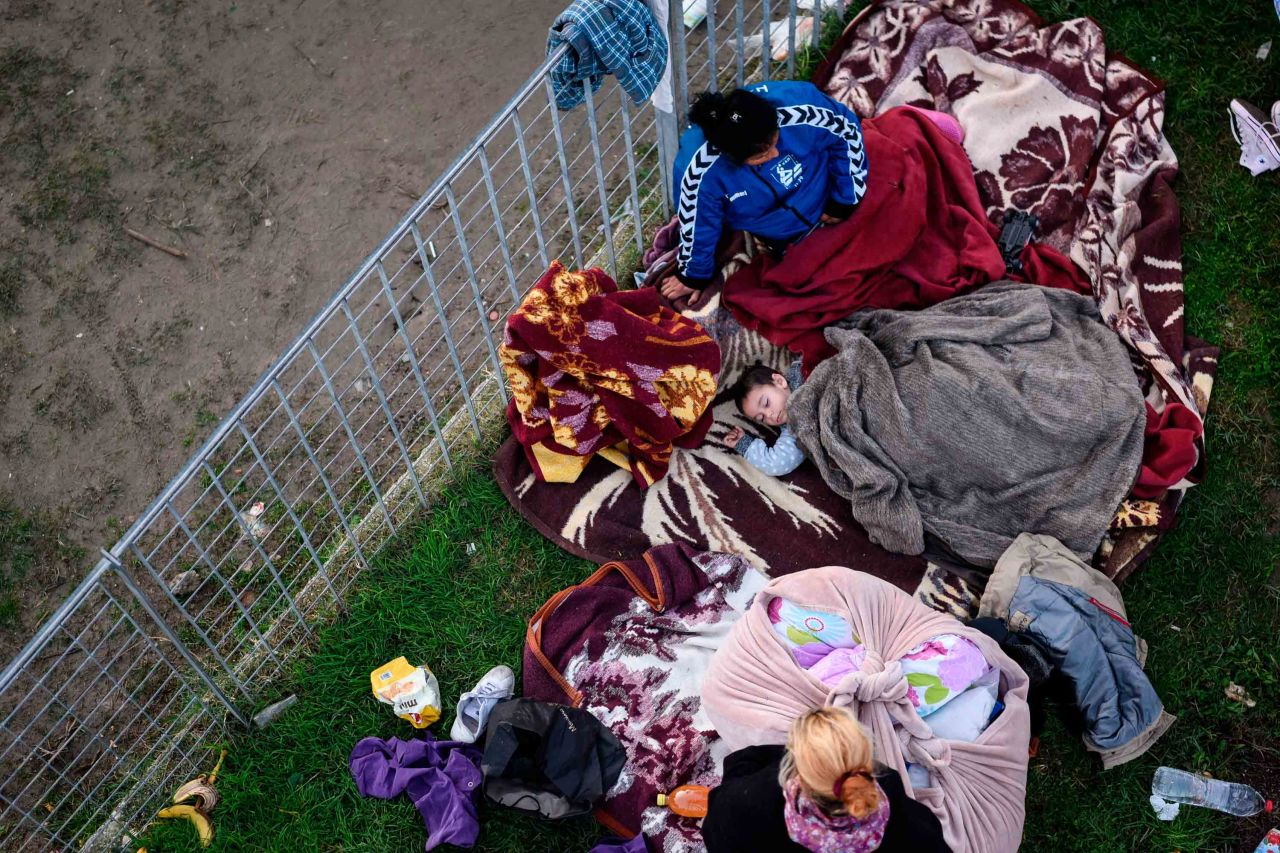 A family shelters at a makeshift camp for earthquake survivors in Durres, Albania, on November 27.