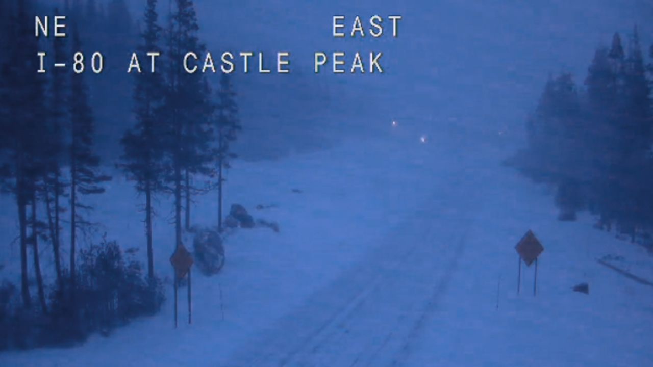 In this still image taken from a Caltrans remote video traffic camera, eastbound Interstate 80 is empty Wednesday morning because of closures and restrictions in Soda Springs, California.
