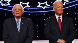 Democratic presidential hopefuls former US Vice President Joe Biden and Vermont Senator Bernie Sanders arrive onstage for the fourth Democratic primary debate of the 2020 presidential campaign season co-hosted by The New York Times and CNN at Otterbein University in Westerville, Ohio on October 15, 2019. 