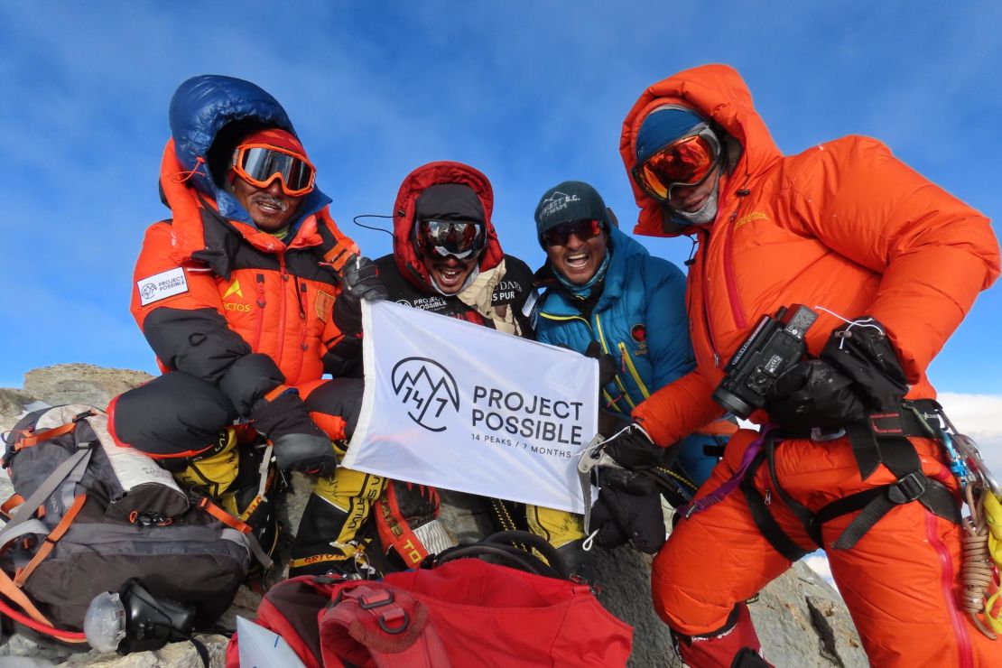 Purja at the summit of Dhaulagiri with members of his team.