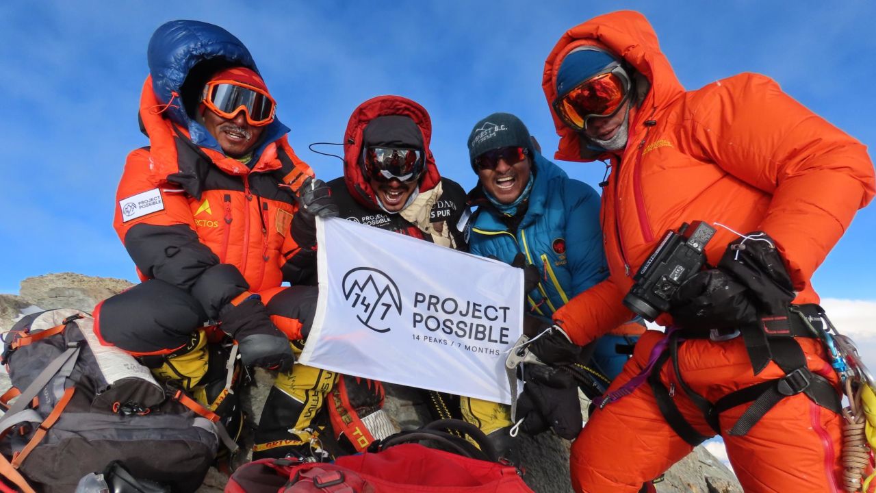 Purja at the summit of Dhaulagiri with members of his team.