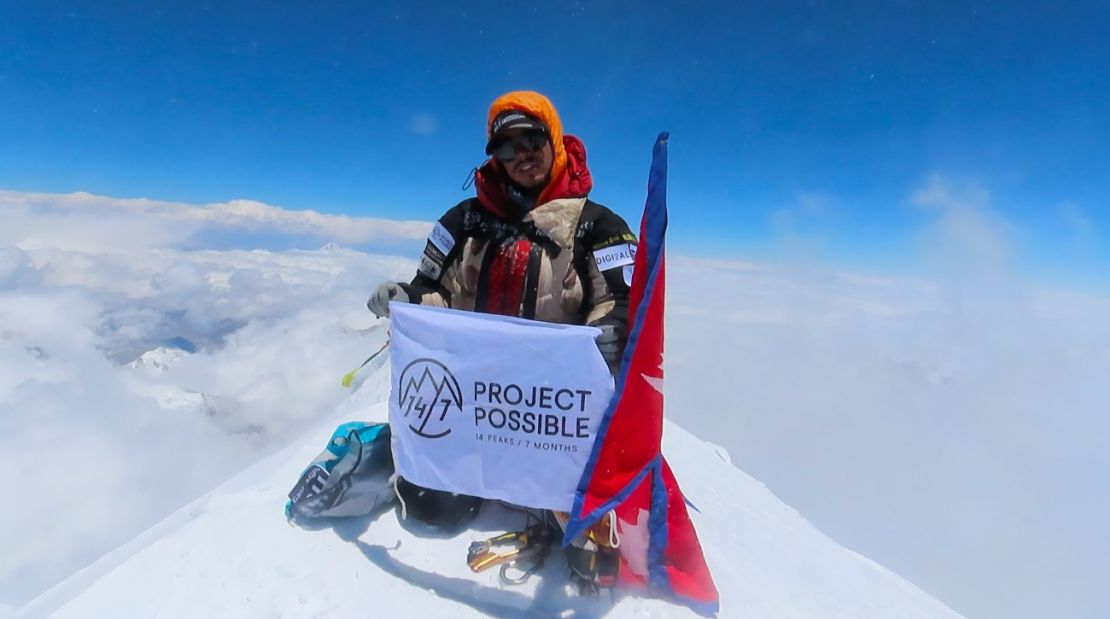 Purja at the summit of the 8,586-meter-tall Kanchenjunga, the world's third highest mountain.