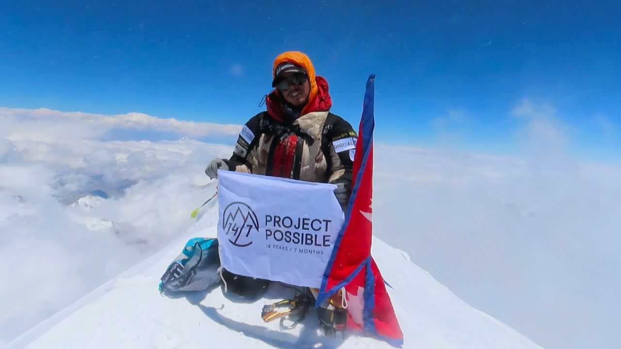 Purja at the summit of the 8,586-meter-tall Kanchenjunga, the world's third highest mountain.