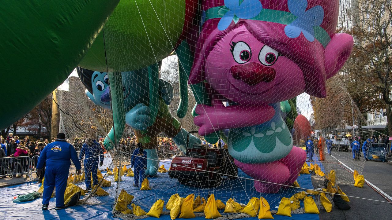 The Trolls balloon is kept under a net during Wednesday's inflation process in New York.