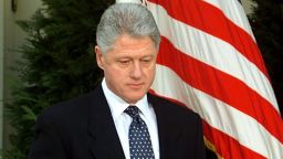 WASHINGTON, :  US President Bill Clinton walks to the podium moments before reading a statement in the Rose Garden of the White House after the Senate voted not to impeach him 12 February in Washington, DC. Clinton apologized for the actions that led to his impeachment and subsequent acquittal by the Senate, saying he was "profoundly sorry."  