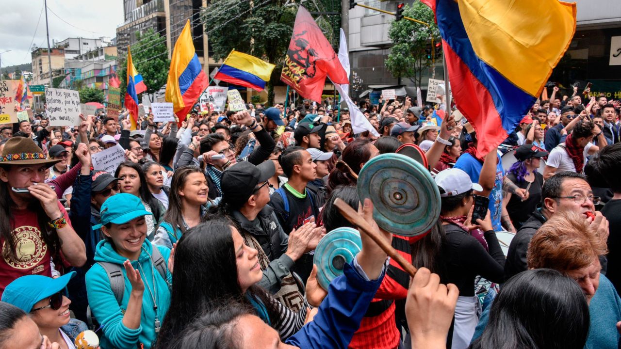 Anti-government demonstrators wave Colombian flags during protests and national strike against government of President Iván Duque on November 27, 2019 in Bogota, Colombia. 