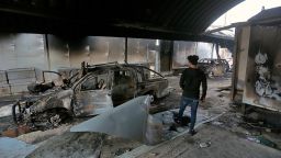 A man inspects the inside of the burned Iranian consulate in Najaf, Iraq, Thursday, Nov. 28, 2019. An Iraqi police official says anti-government protesters have burned down the Iranian consulate in southern Iraq late Wednesday. Protesters torched the Iranian consulate building in the holy city of Najaf, the seat of the country's Shiite religious authority. Iranian staff working in the consulate escaped through the back door and were not harmed. (AP Photo/Anmar Khalil)