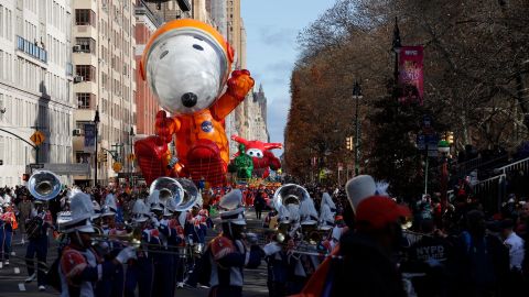 Handlers kept Astronaut Snoopy relatively close to ground Thursday as they made their way down the parade route.