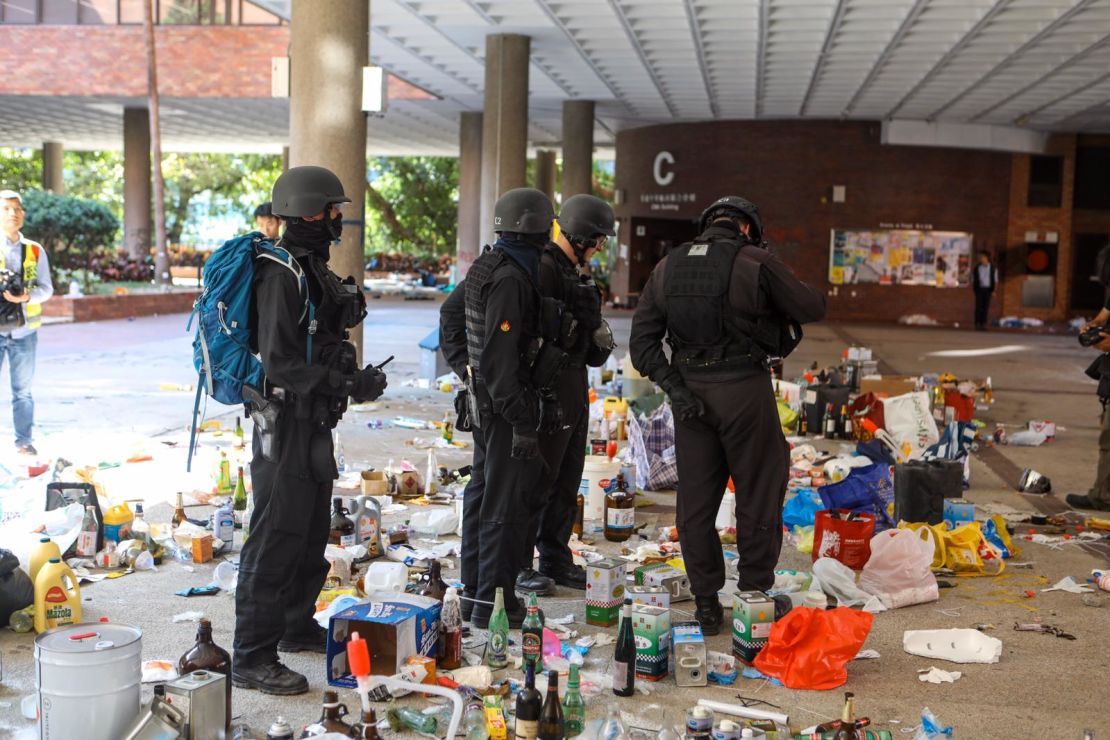 Police are seen standing by unused petrol bombs on the Hong Kong Polytechnic University campus on Thursday, November 28.