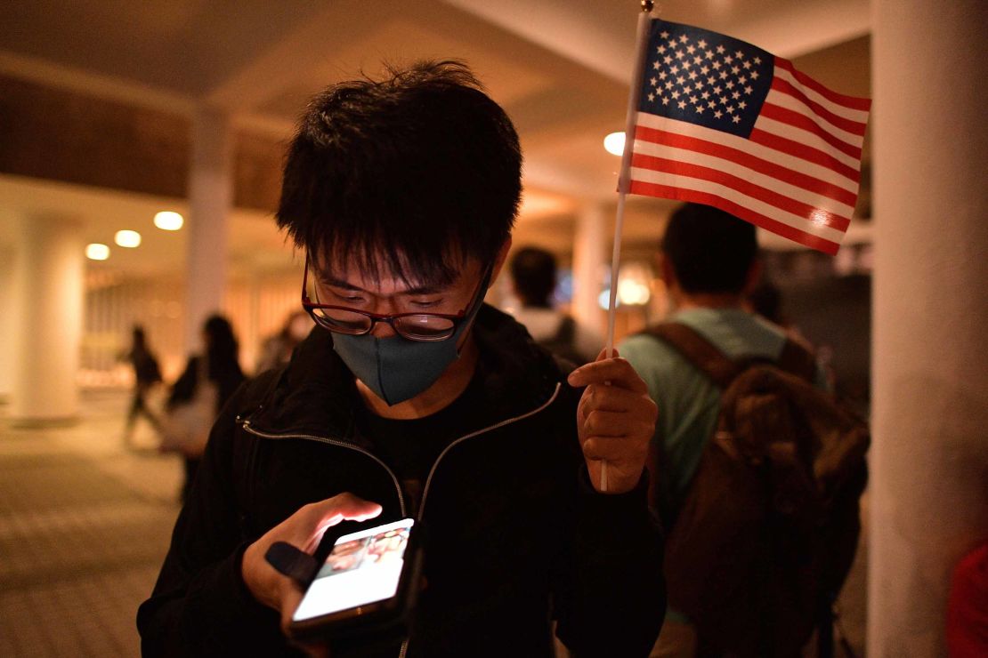 A pro-democracy protester holds up a US flag during a gathering of thanks at Edinburgh Place in Hong Kong's Central district.