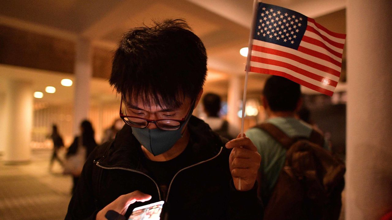 A pro-democracy protester holds up a US flag during a gathering of thanks at Edinburgh Place in Hong Kong's Central district.
