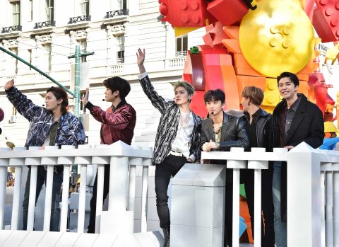 Boy band NCT 127 waves to fans.