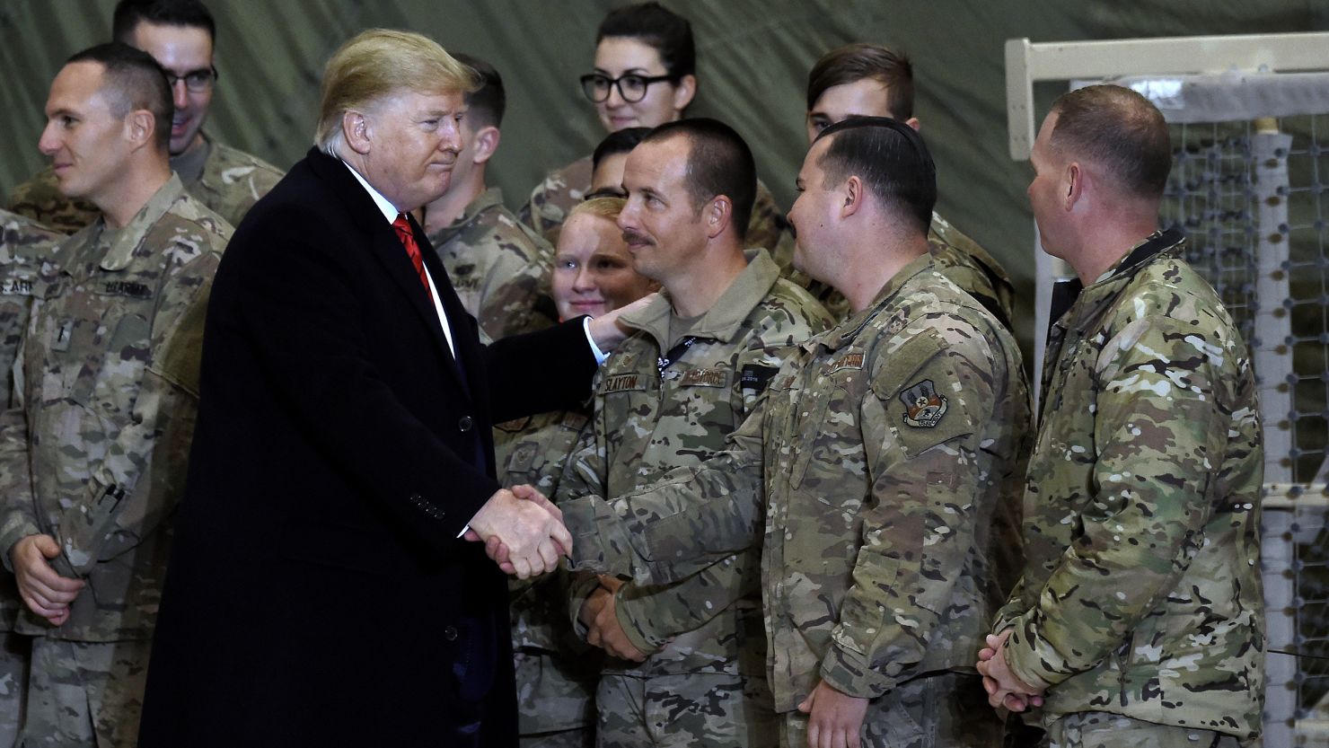 US President Donald Trump greets soldiers after speaking to the troops during a surprise Thanksgiving day visit at Bagram Air Field, on November 28, 2019 in Afghanistan.