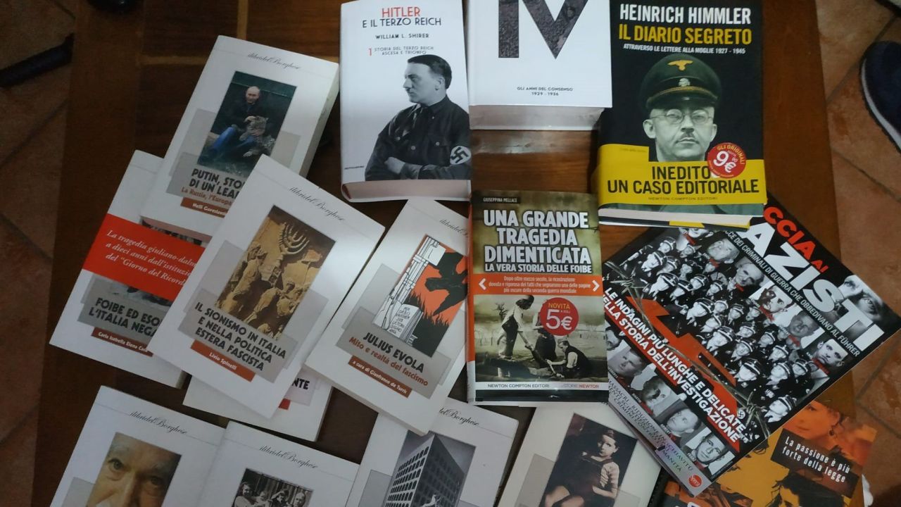 Police searched 19 homes across Italy and found books, plaques and flags with images of Adolf Hitler and Benito Mussolini.