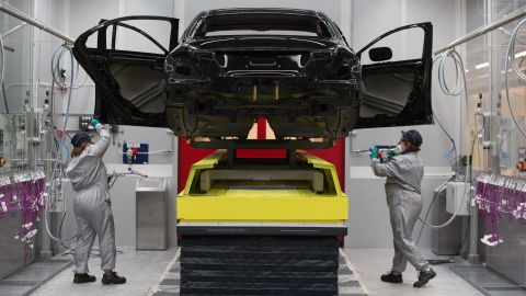 Workers check a Mercedes-Benz E-Class at a plant in Moscow.