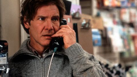 Harrison Ford talks on a pay phone in a scene from the 1993 film, "The Fugitive."