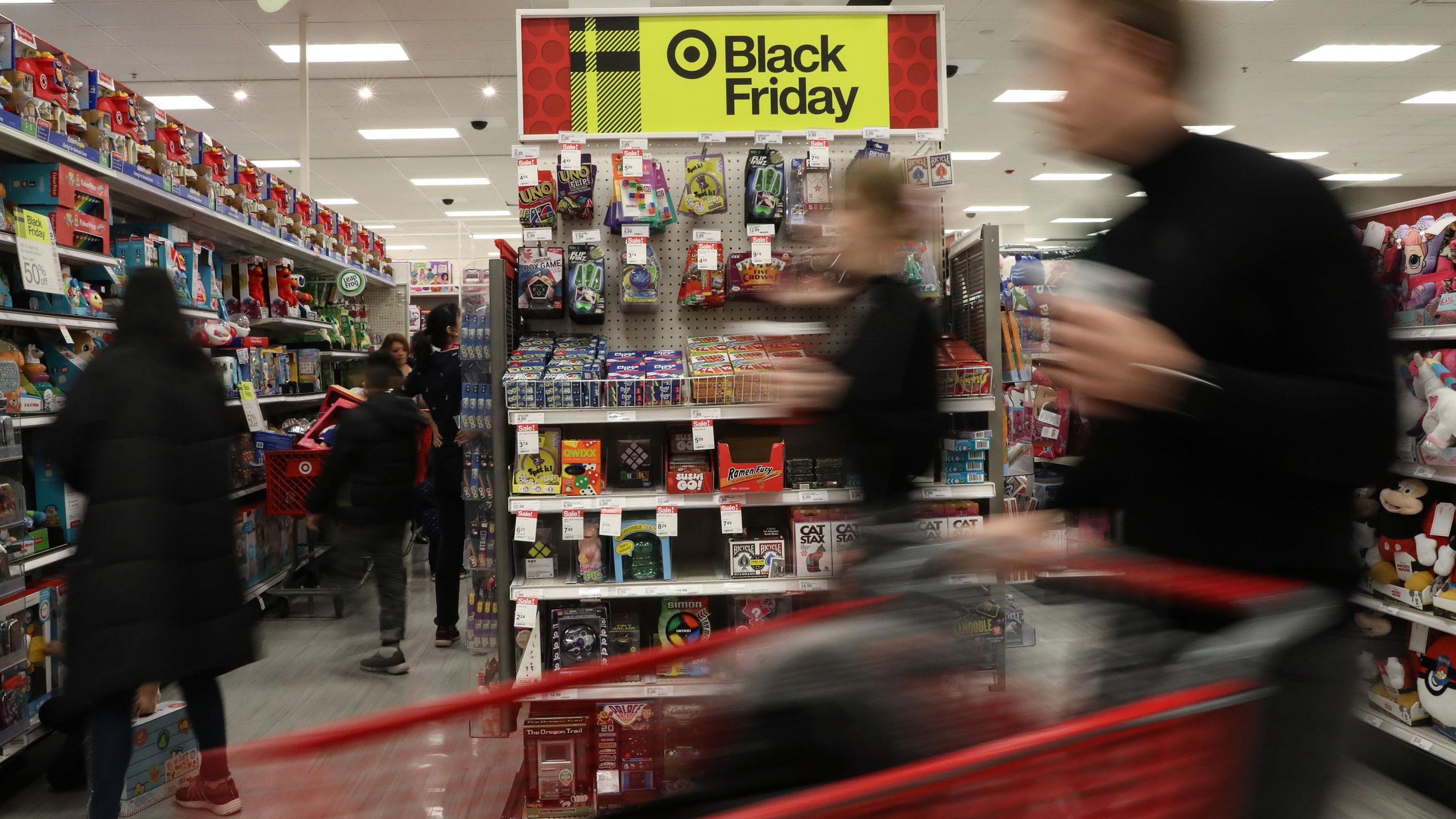 Customers walk past a toy section of a Target store in New York.