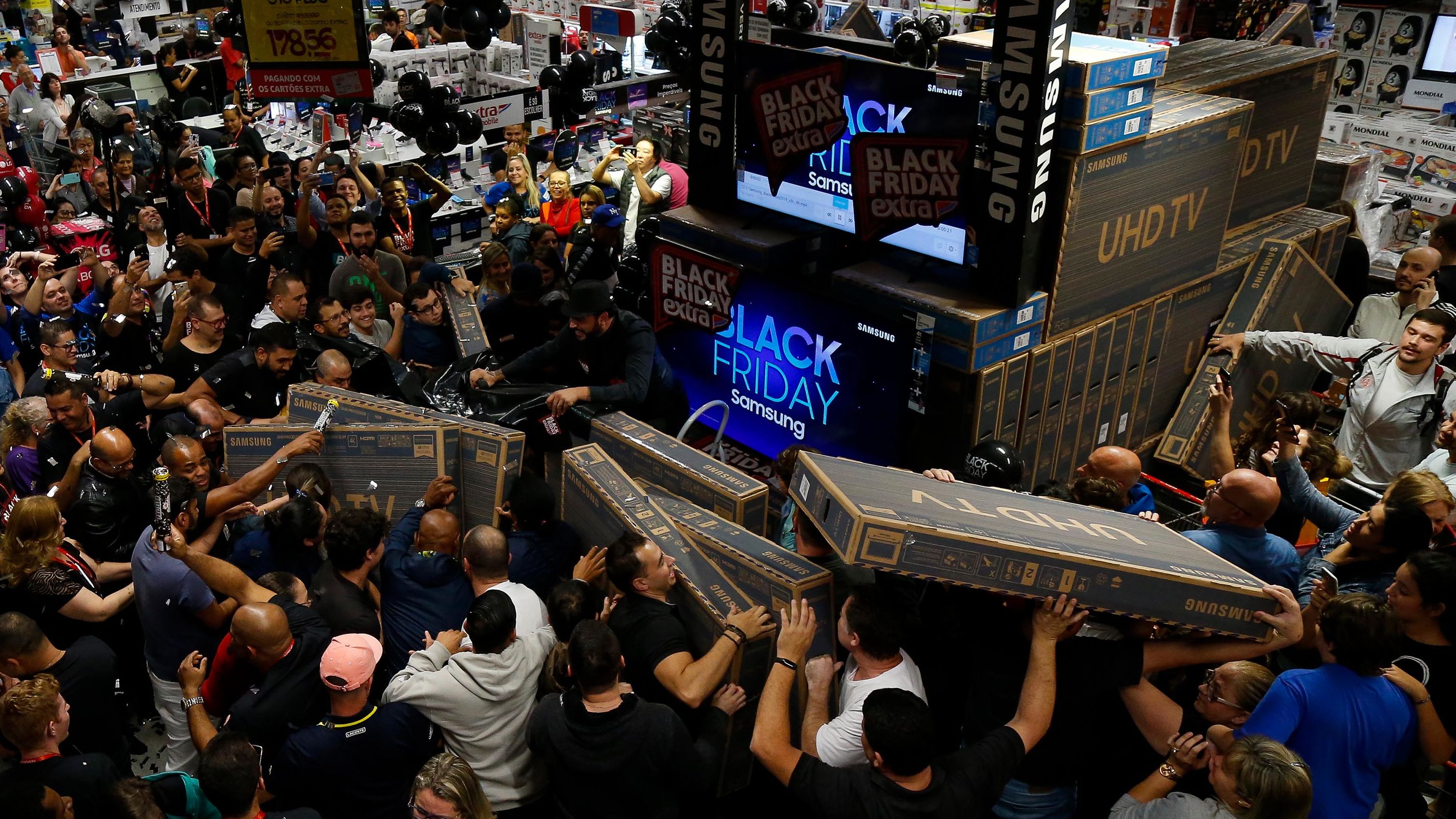 Shoppers buy TV sets during a Black Friday sale in Sao Paulo, Brazil, on Thursday, November 28.