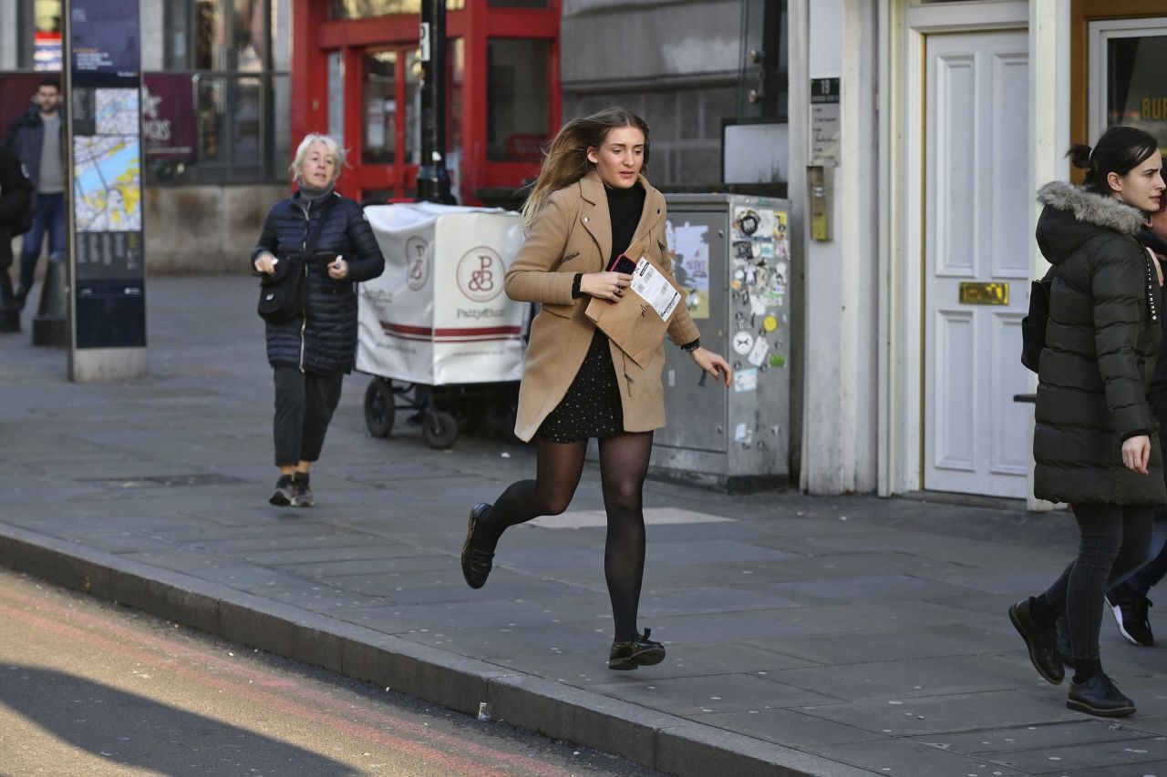 A woman runs from the London Bridge area.