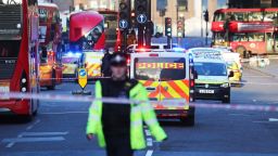 Police and emergency services at the scene of an incident on London Bridge in central London following a police incident, Friday, Nov. 29, 2019. British police said Friday they were dealing with an incident on London Bridge, and witnesses have reported hearing gunshots.  The Metropolitan Police force tweeted that officers were "in the early stages of dealing with an incident at London Bridge." (Gareth Fuller/PA via AP)