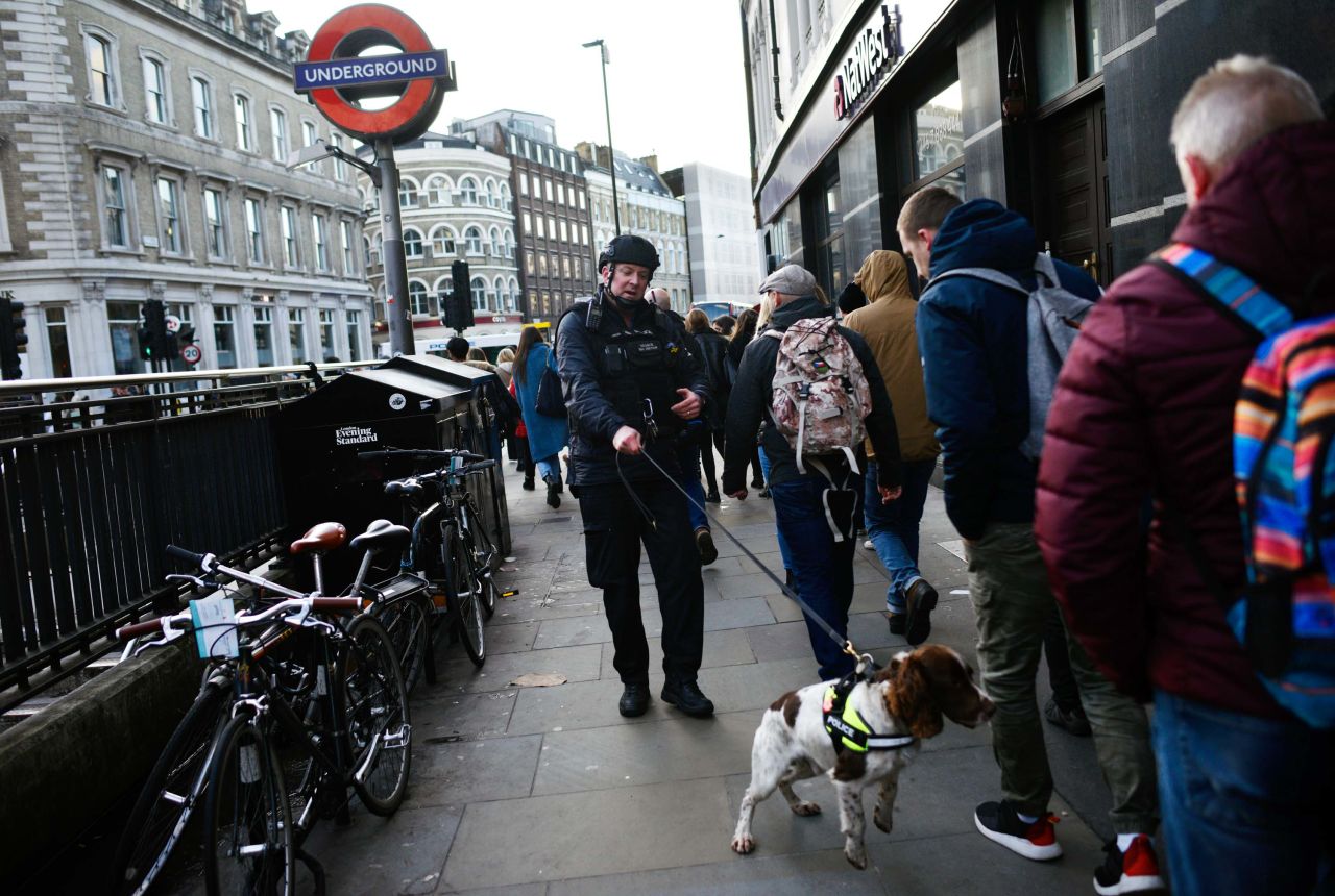 A police officer and dog work near Borough Market.