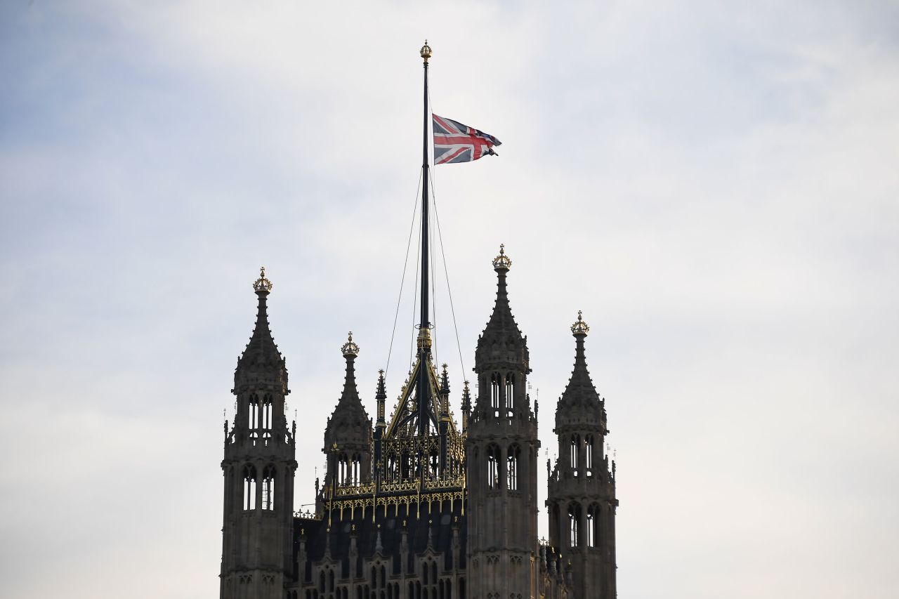 The Union Flag flies at half mast on the Victoria Tower in London.