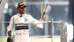 ABU DHABI, UNITED ARAB EMIRATES - DECEMBER 01: Race winner Lewis Hamilton of Great Britain and Mercedes GP celebrates on the podium during the F1 Grand Prix of Abu Dhabi at Yas Marina Circuit on December 01, 2019 in Abu Dhabi, United Arab Emirates. (Photo by Mark Thompson/Getty Images)
