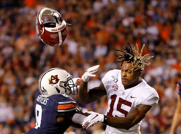 Shaun Shivers of the Auburn Tigers knocks the helmet off Xavier McKinney of the Alabama Crimson Tide as he rushes for a touchdown at Jordan-Hare Stadium in Auburn, Alabama, on November 30. 