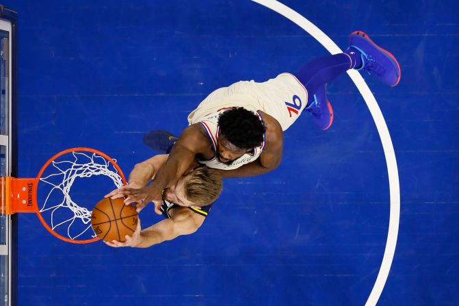 Indiana Pacers' Domantas Sabonis goes up for a dunk against Philadelphia 76ers' Joel Embiid in Philadelphia on November 30.