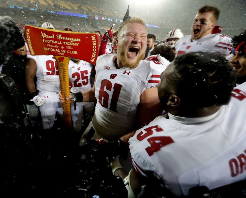 Wisconsin offensive lineman Tyler Biadasz celebrates with the Paul Bunyan Axe after the Wisconsin Badgers advance to the Big Ten title game on November 30.