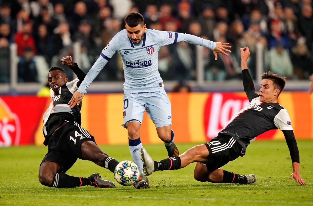 Madrid's Ángel Correa challenges for the ball during the Champions League group D soccer match between Juventus and Atletico Madrid at the Allianz stadium in Turin, Italy, on November 26.