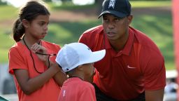 Tiger Woods stands with his children Sam(L) and Charlie after the Quicken Loans National at Congressional Country Club in Bethesda, Maryland on on June 26, 2016. / AFP / ANDREW CABALLERO-REYNOLDS        (Photo credit should read ANDREW CABALLERO-REYNOLDS/AFP via Getty Images)
