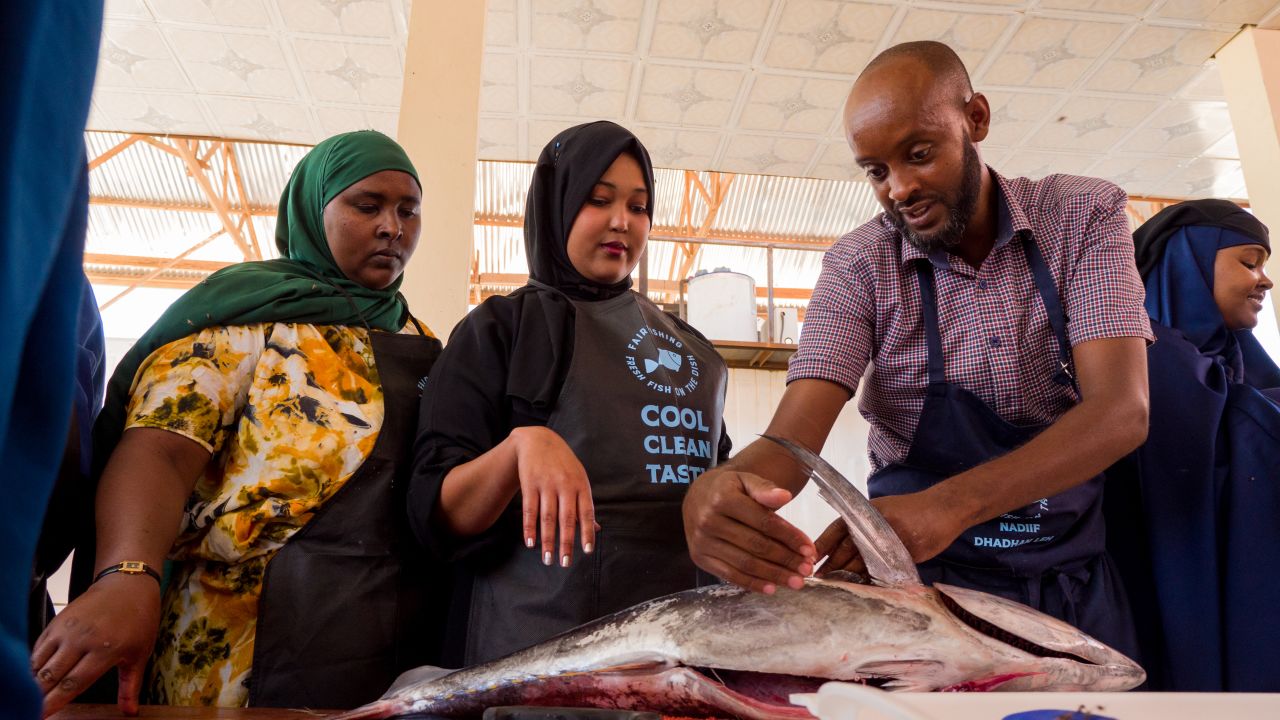 A FairFishing chef, Suleiman Farah, at a 'Fresh Fish on the Dish' training, where female householders, chefs and fish mongers learn how to handle and prepare fish. 