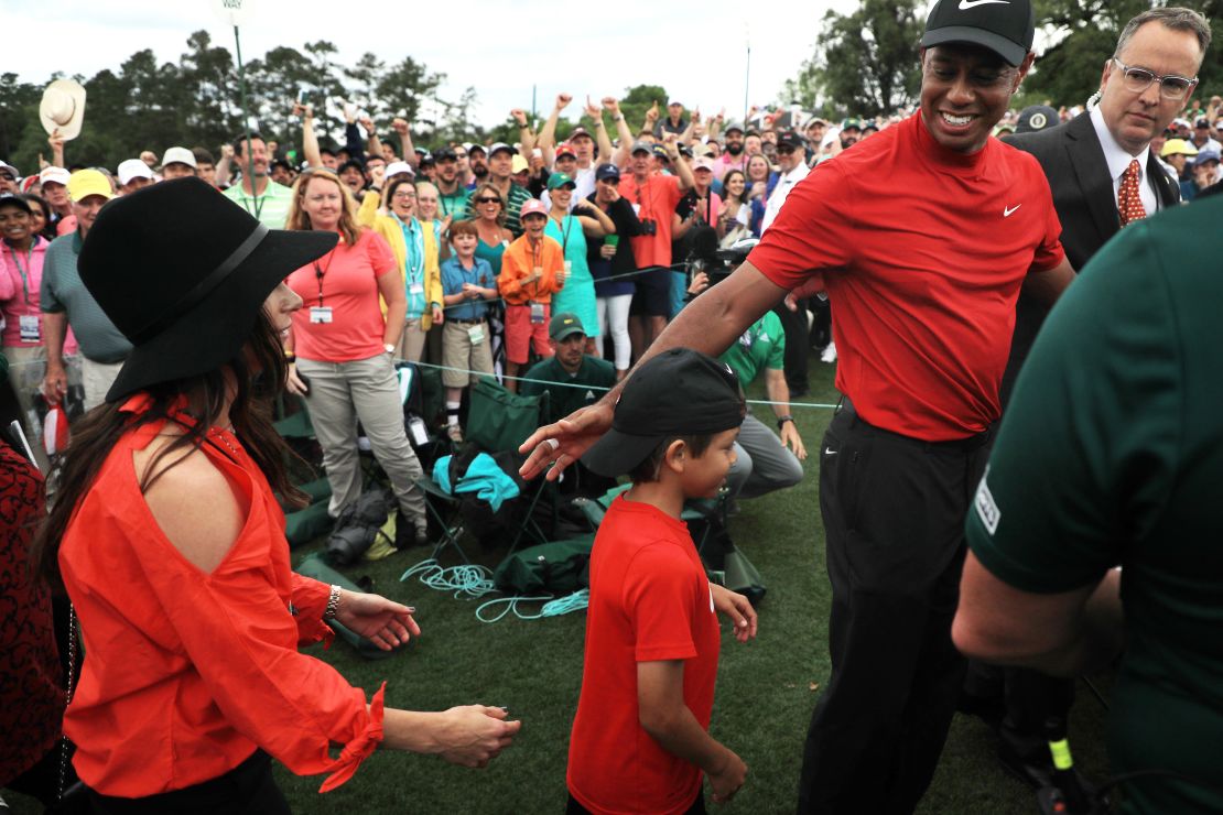 Tiger Woods celebrates with his son Charlie after winning his fifth Masters title. 