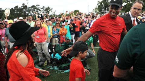 Tiger Woods celebrates with his son Charlie after winning his fifth Masters title. 