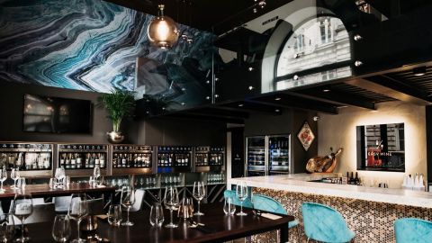 This trendy bar serves around 100 wines by the glass.
